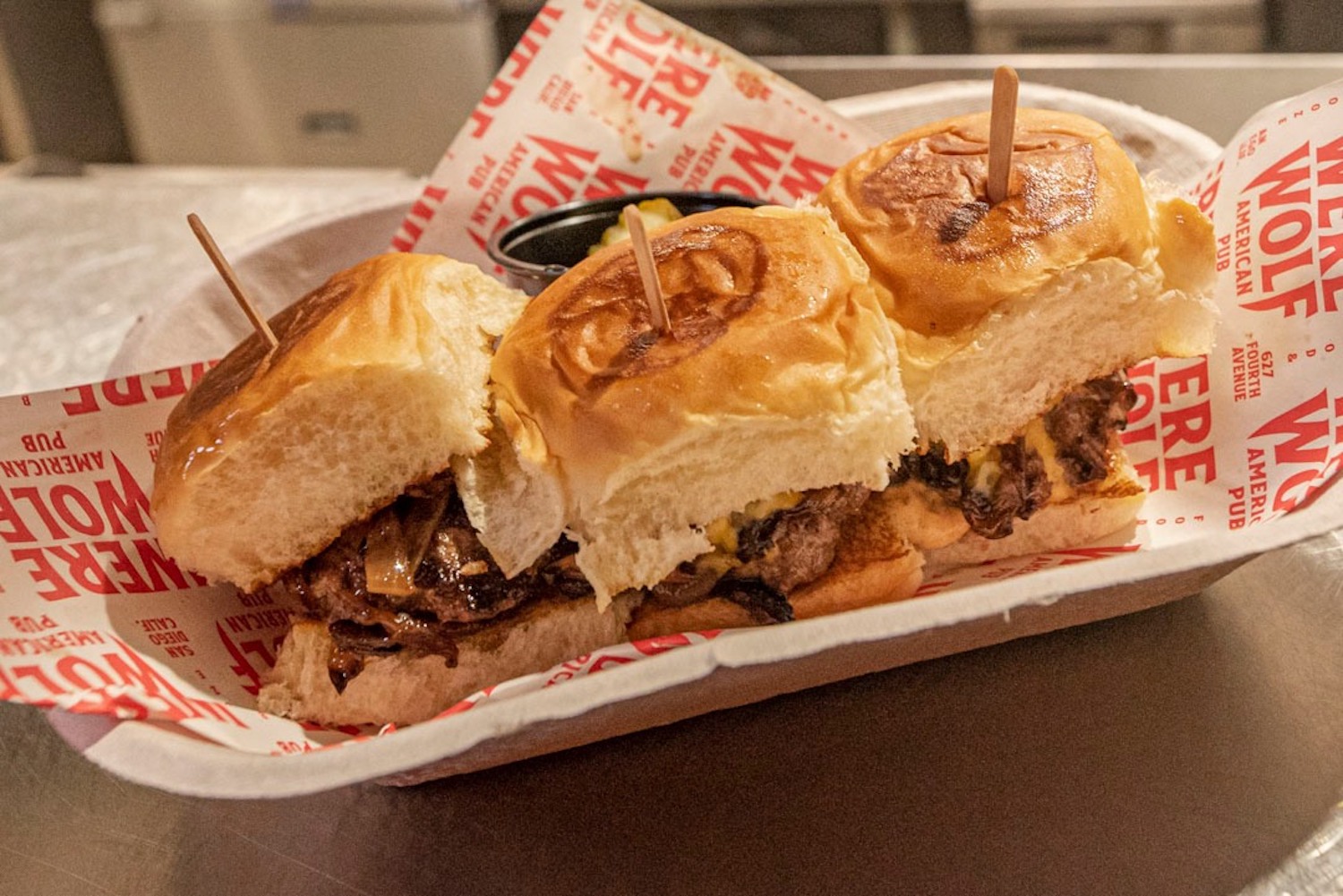 Werewolf signature dishes Hand Breaded Chicken StripsTriple Threat BurgerCrispy Chipotle Chicken Sammy